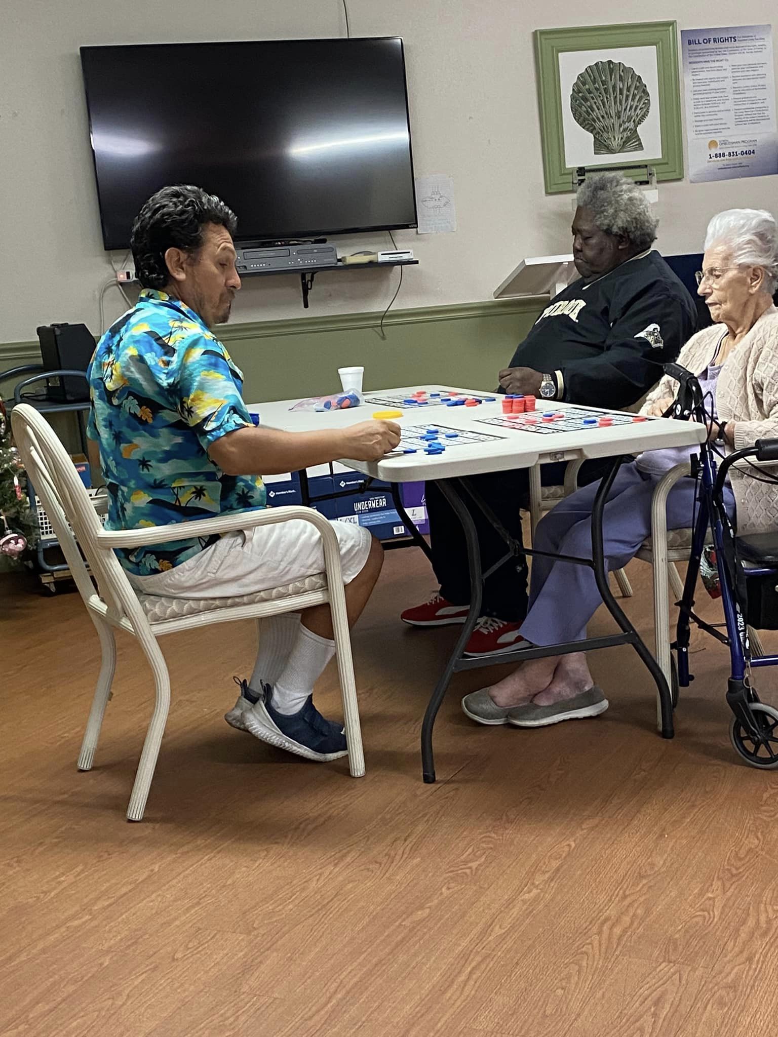 residents playing checkers at the lakeland assisted living facility